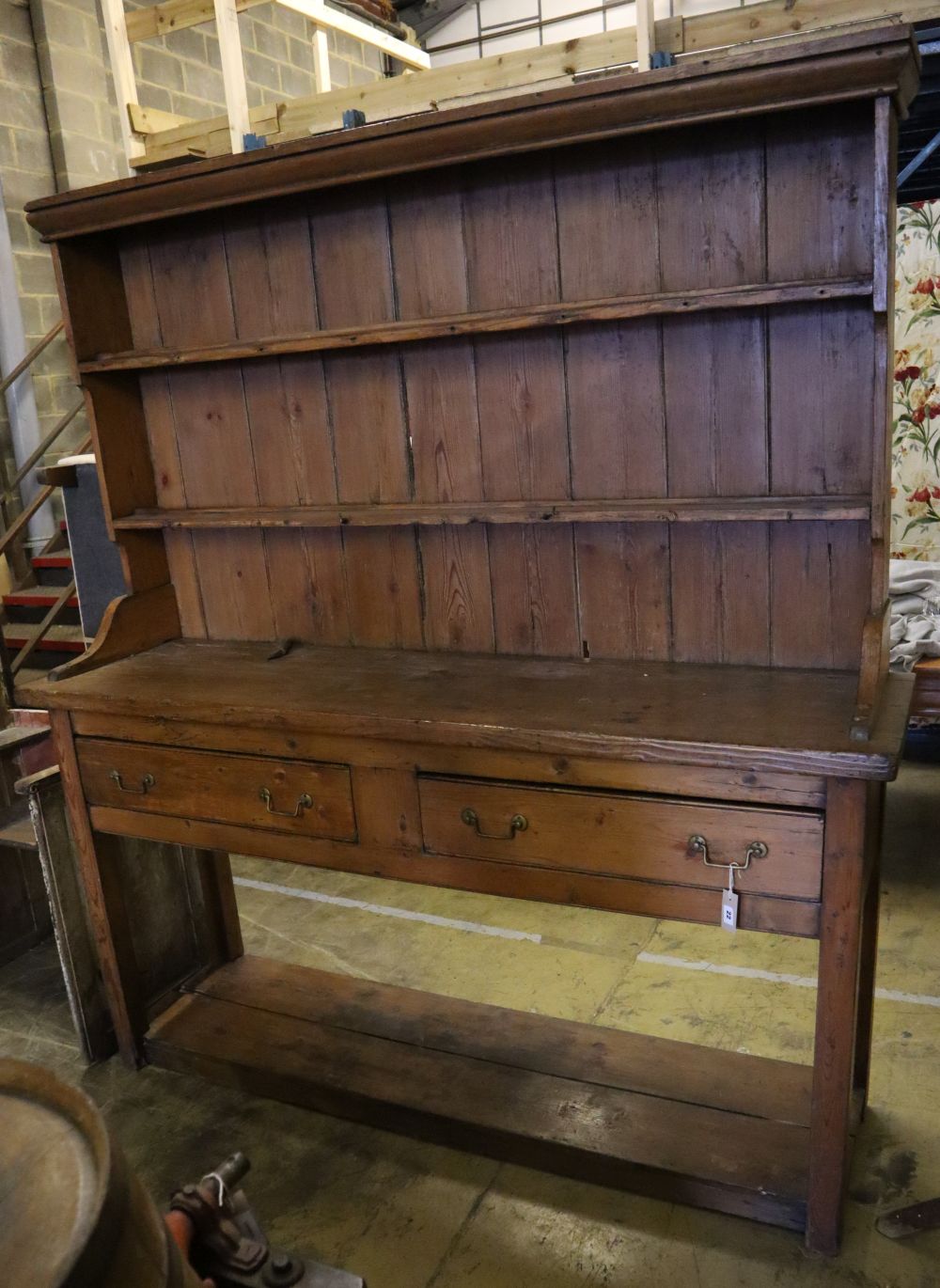 A late 18th century stripped pine dresser, width 182cm depth 50cm height 202cm